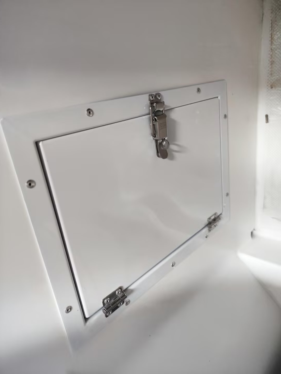 NRH 5829-84K stainless steel latch installed on marine access panel - 304 stainless steel, vibratory finish, 588N tensile strength