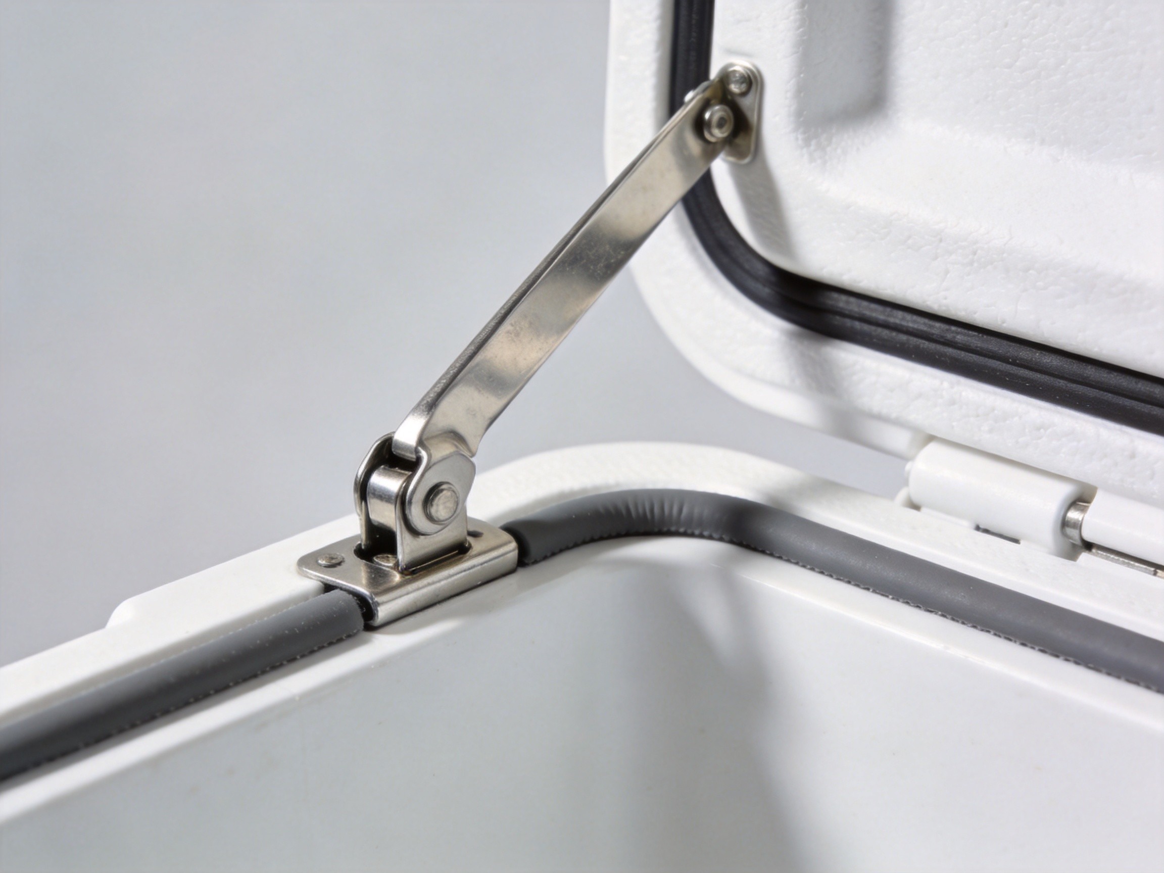 Comparison detail of swing arm latch mechanism on insulated case hardware